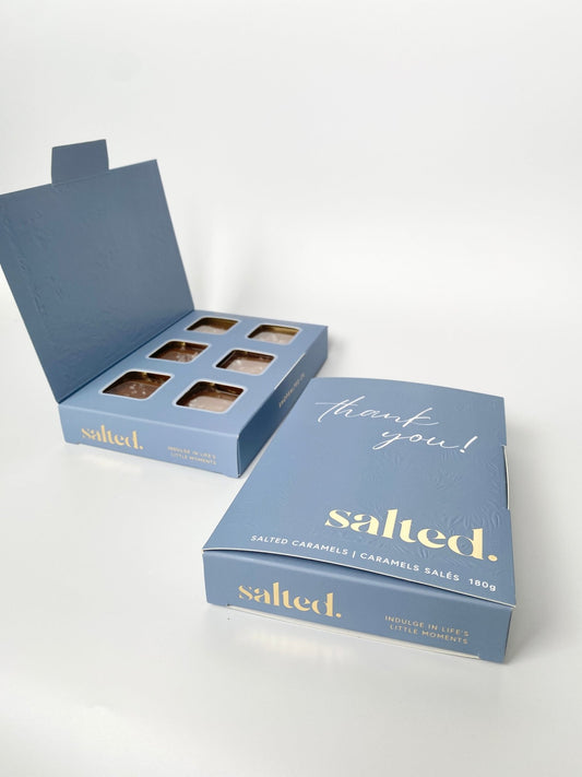 Elegant blue Thank You card box with gold details containing 6 handmade salted caramels from Shop Salted